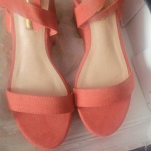 Peach colored orange wedge heel
